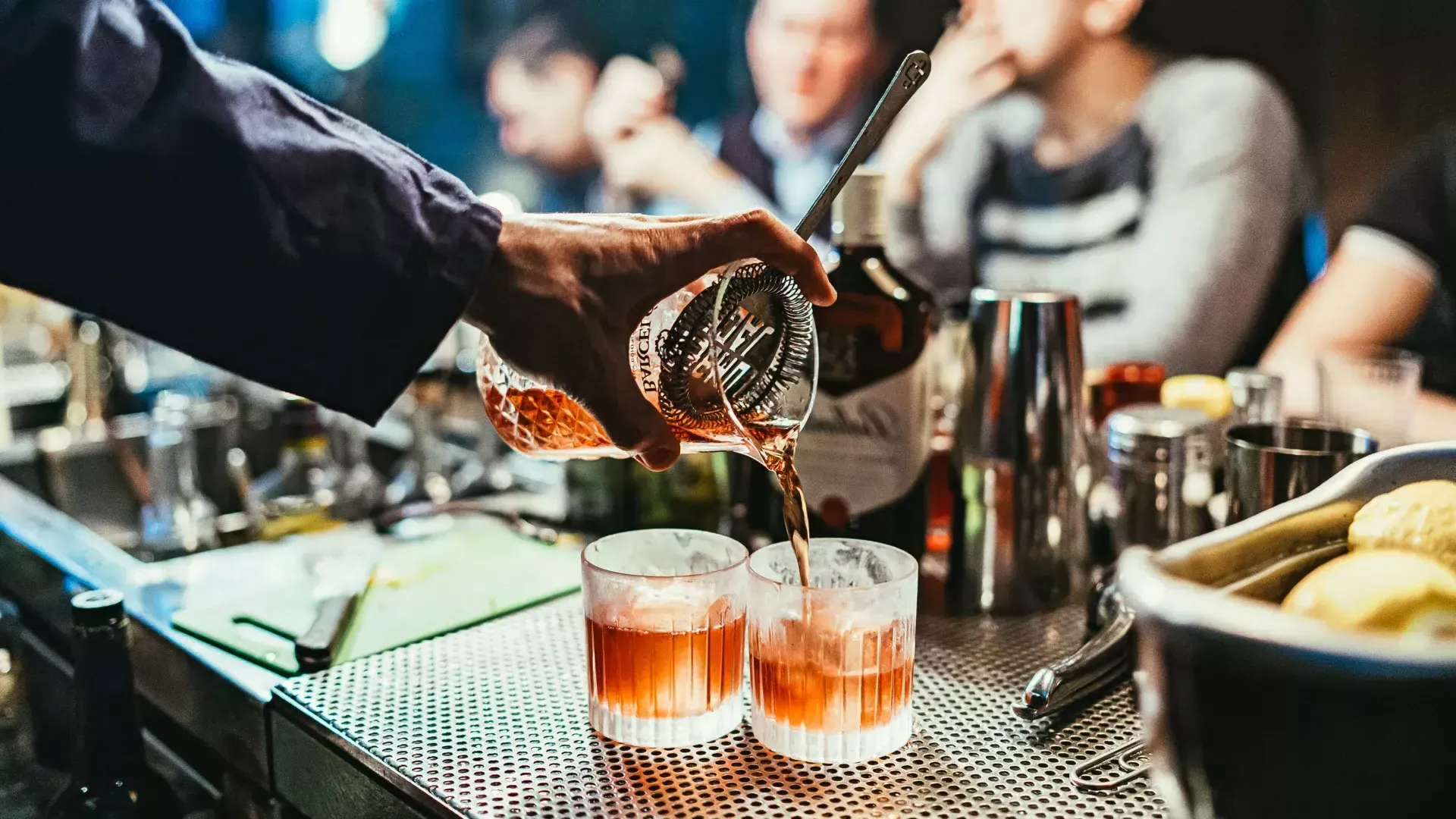 Bartender pouring cocktails