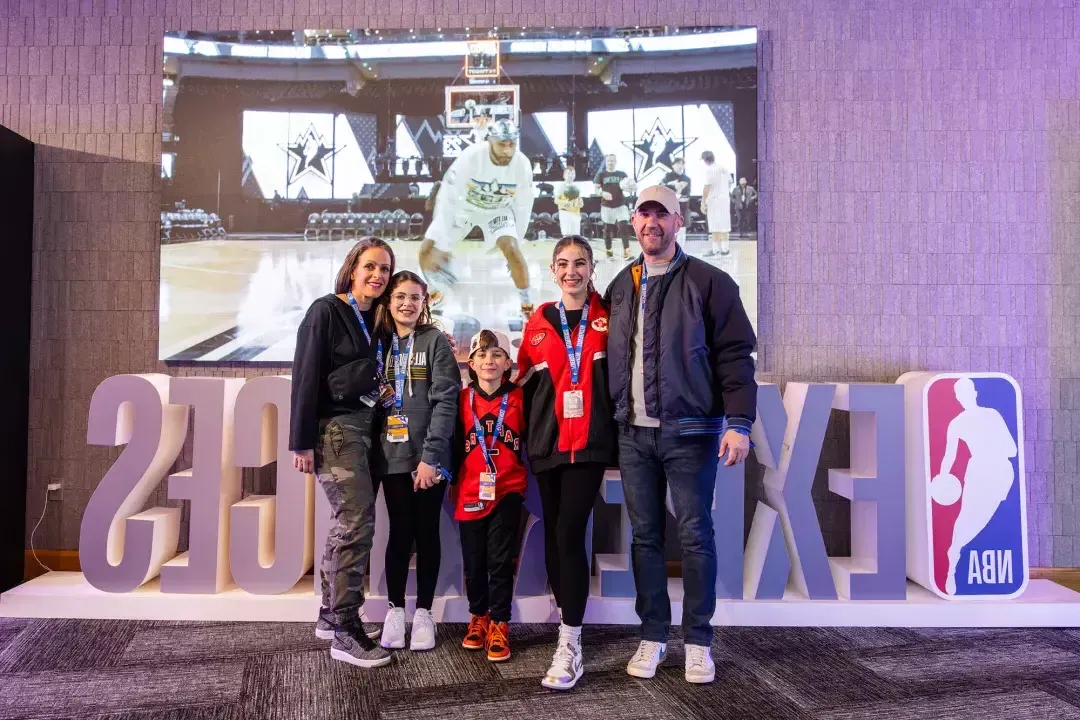 A family of basketball fans attends the NBA All-Star Game festivities.